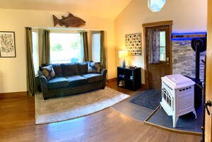 Apartamento luxo, 1 quarto | Área de estar | Pisos aquecidos