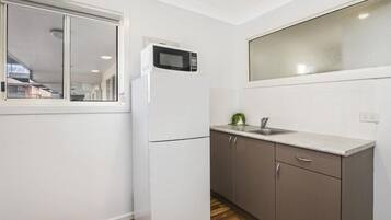 Fridge, microwave, toaster, dining tables