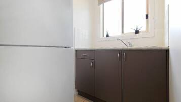 Fridge, microwave, toaster, dining tables