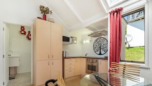 Comfort Studio Suite | Private kitchen | Coffee/tea maker, full-size fridge, microwave, oven - Villa Sanctuary at Palm Beach (Waiheke Island)