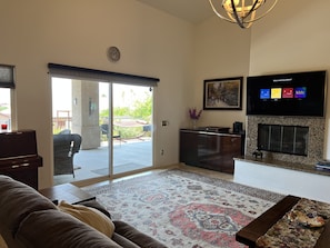 Smart TV, fireplace, books