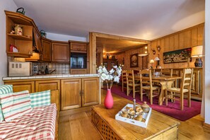 Open plan dining and living area with family dining table