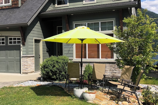 Relax and unwind on our patio overlooking the front garden and nearby mountains