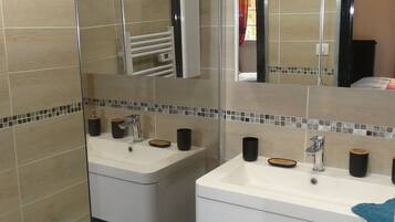 Shower, hair dryer, towels, toilet paper