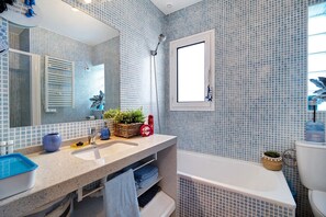 Bathtub, hair dryer, towels