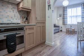 Apartment (1 Bedroom) | Private kitchen | Full-sized fridge, microwave, oven, stovetop - Arcadia - 1 Bedroom Apartment - Tenby (Tenby)