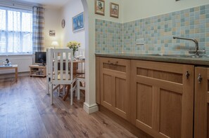 Apartment (1 Bedroom) | Private kitchen | Full-sized fridge, microwave, oven, stovetop - Arcadia - 1 Bedroom Apartment - Tenby (Tenby)