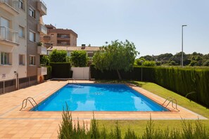 Enjoy a refreshing swim in the pool surrounded by a spacious deck and beautifully manicured grounds.