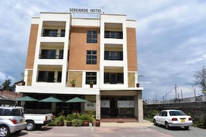 A multi-story hotel with a sign reading "Serenade Hotel". - Seranade Hotel Nakuru (Nakuru)