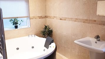 Bathtub, towels, toilet paper