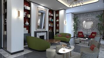 Een moderne woonkamer met groene banken, een open haard, boekenkasten en een grote spiegel.