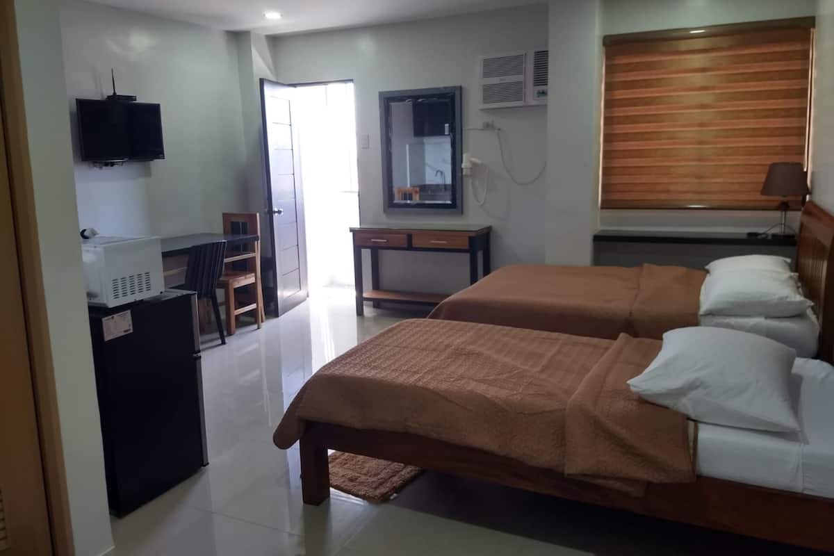 Habitación Deluxe con 2 camas individuales | Ropa de cama