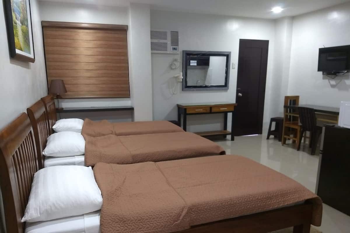 Habitación triple estándar | Ropa de cama