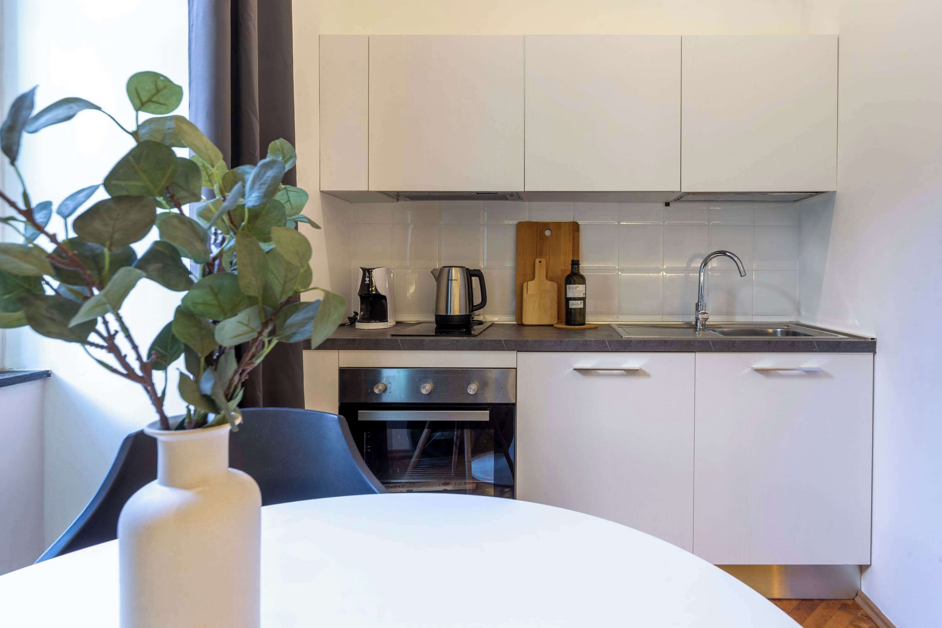 Fridge, oven, coffee/tea maker, cookware/dishes/utensils