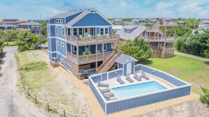 A two-story house with a large deck, a swimming pool, and a covered outdoor area. - Semi-Oceanfront Home w/ Private Pool, Tiki Bar, Hot Tub (Salvo)