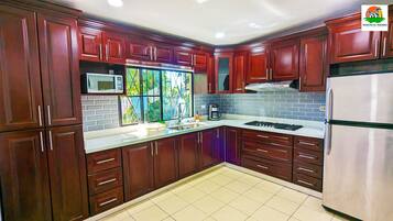 Fridge, microwave, stovetop, coffee/tea maker