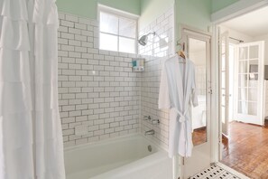 Combined shower/bathtub, hair dryer, towels, soap