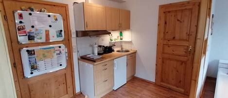 Fridge, microwave, stovetop, coffee/tea maker