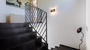 A staircase with black steps and a metal railing. - Fc-f139-mini0at - Villa Mia 6 (Mercato Saraceno)