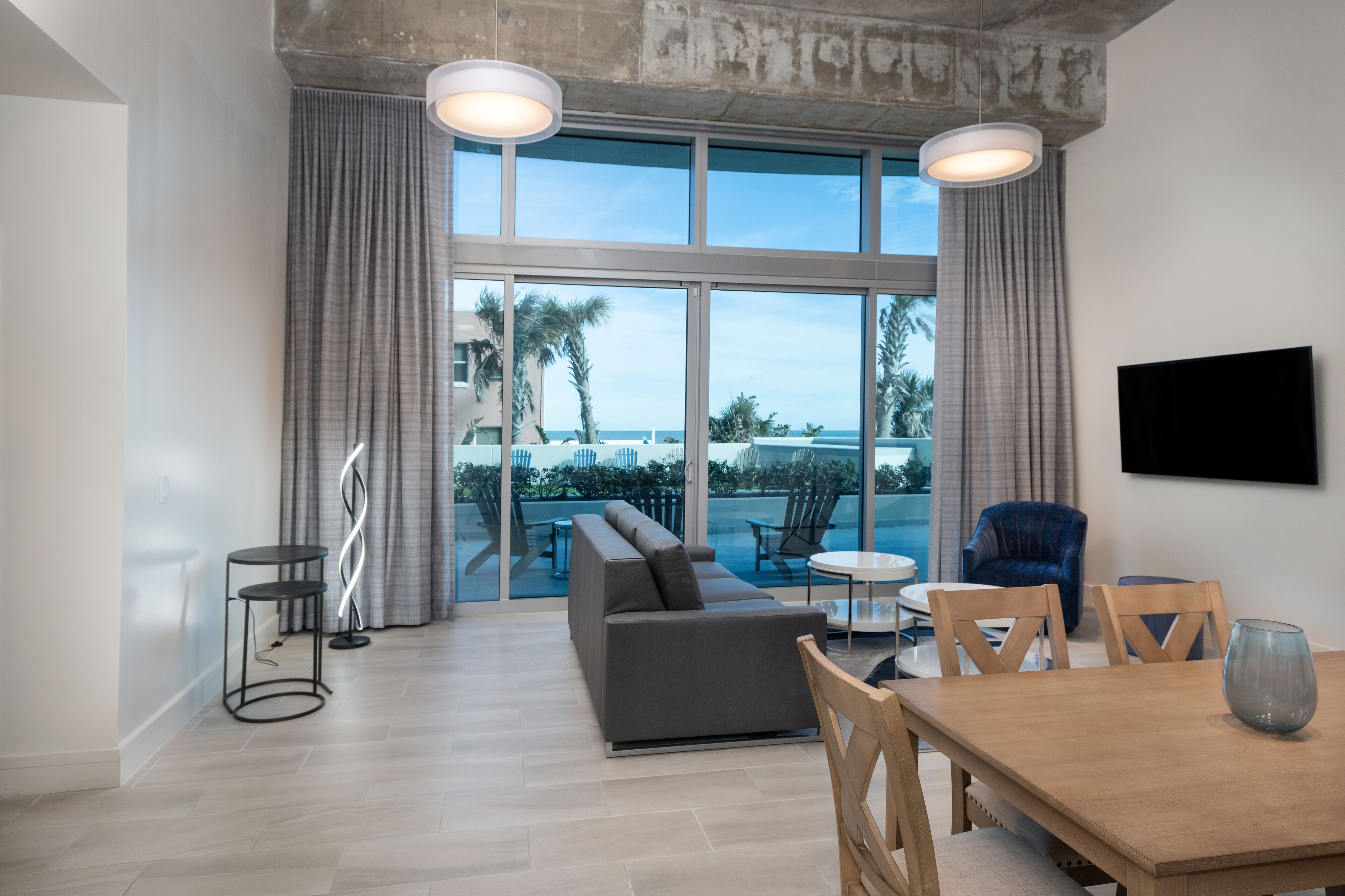 Room, 1 Bedroom (First Floor Walkout) | Living area | 65-inch flat-screen TV with cable channels, TV