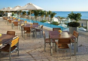 Outdoor dining - Private Beachfront Condominium with Resort and Amenities Access (Sunny Isles Beach)