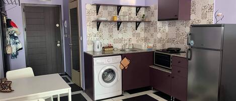 Fridge, oven, electric kettle, cookware/dishes/utensils