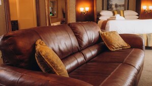 A brown leather sofa with two cushions in a hotel room. - The Guv’nor (St. John's)