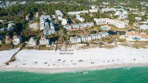 An aerial view of a coastal residential area with multiple buildings, a beach, and a designated beach access point labeled "Spooky Lane." - 30A Retreat, Walk 250 yds to Beach, Pool, Hot Tub, 4 Bikes, Umbrella, Chairs! (Walton County)
