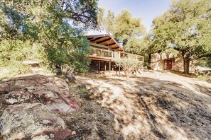 Set amidst lush surroundings, this two-story building features a balcony and a charming exterior.