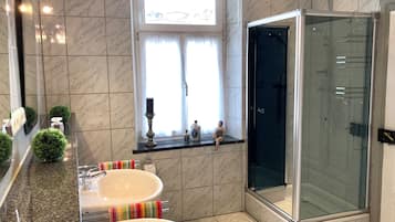 Bathtub, hair dryer, towels, soap