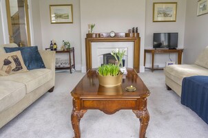 32-inch flat-screen TV with cable channels, TV