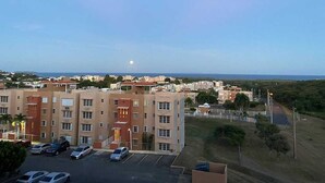 A multi-story building with a parking lot in the foreground. - Apartment with ocean view near Ceiba FerryTerminal (Ceiba)
