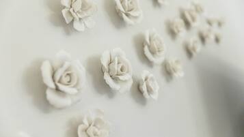 A close-up of several white paper flowers arranged on a surface.