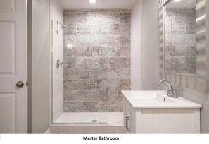 Combined shower/tub, hair dryer, towels, soap
