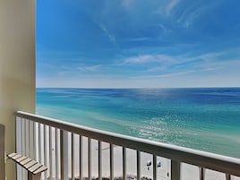 A balcony with a view of the ocean.