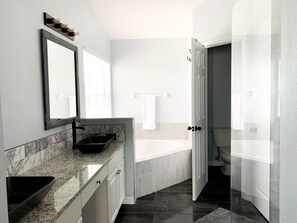 Bathtub, hair dryer, towels, soap