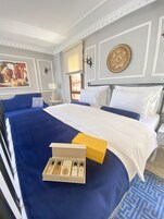 Habitación Deluxe con 1 cama doble o 2 individuales | Sábanas de algodón egipcio y ropa de cama de alta calidad