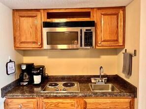 Fridge, microwave, stovetop, coffee/tea maker