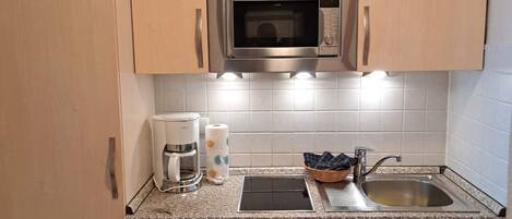 Fridge, microwave, stovetop, coffee/tea maker