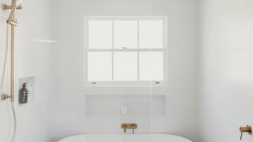 Bathtub, hair dryer, towels, soap