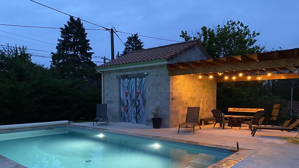 A swimming pool with a pergola and outdoor seating area. - Vacations in Pomié (Baladou)