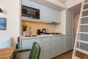 Fridge, microwave, stovetop, coffee/tea maker