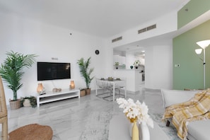 Comfort Apartment | Living area | 32-inch flat-screen TV with cable channels, TV