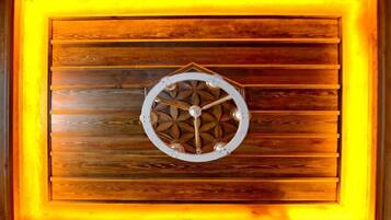 A wooden panel wall with a circular decorative element in the center.