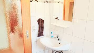 Combined shower/tub, hair dryer