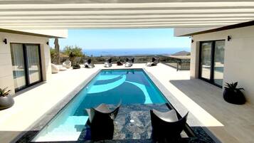 Outdoor pool, a heated pool, sun loungers