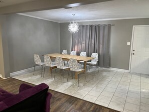Enjoy meals in this stylish dining area with a large table and comfortable seating for eight.