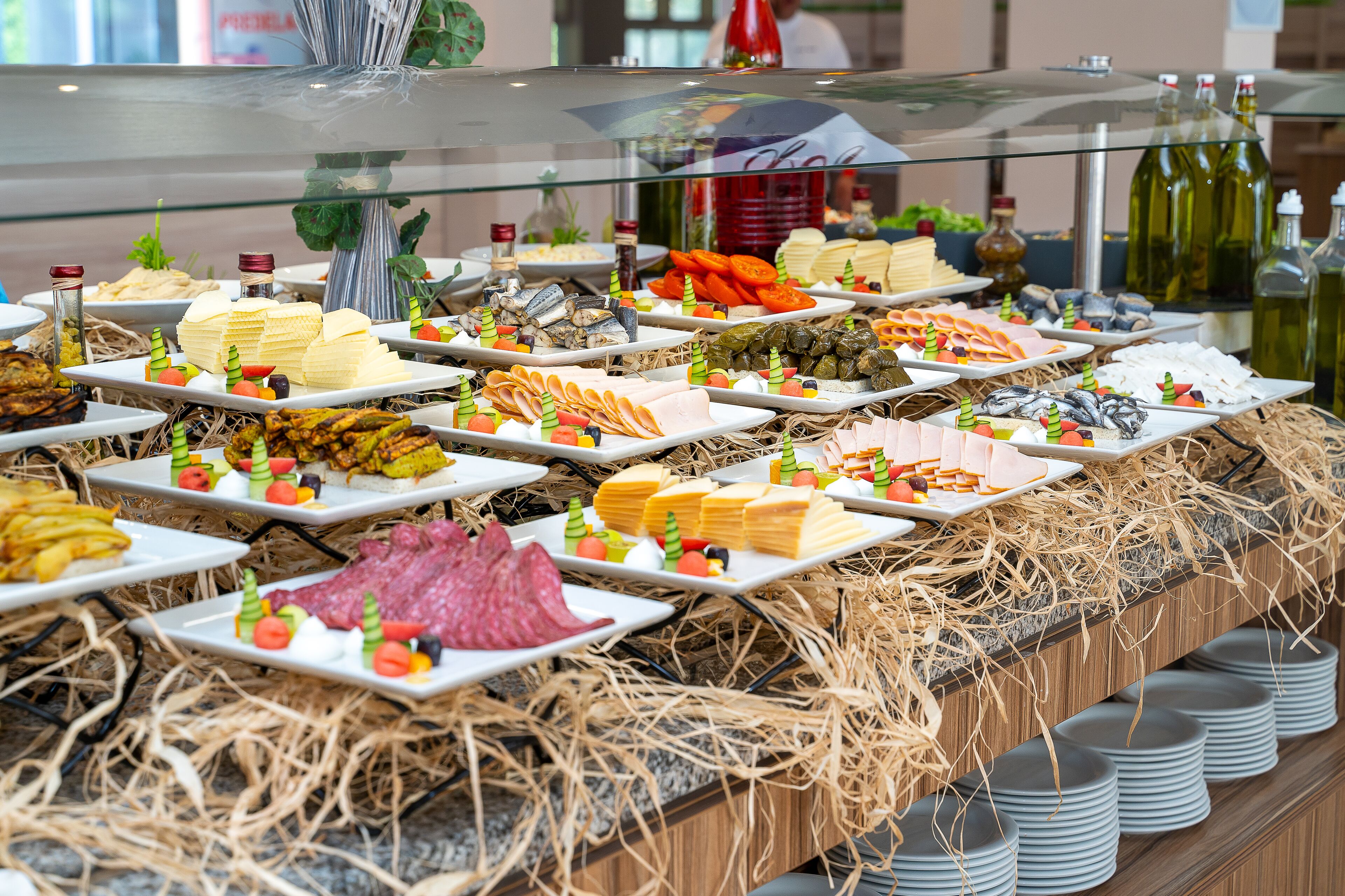 A buffet with various food items and condiments.