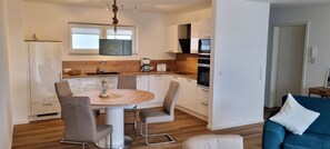 Fridge, microwave, oven, stovetop - 49.3.M Ankerplatz - Modern, high-quality vacation apartment, sauna, large balcony, (Wangerland)