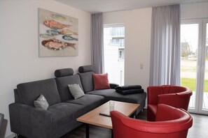 TV, fireplace - House No. 24, Holiday home Fischerhus - Modern vacation home, fireplace, sauna, south (Wangerland)